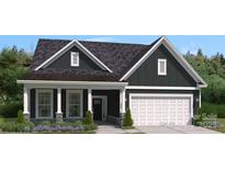 Charming home featuring dark siding, a welcoming front porch, and a two car garage at 909 Exeter Dr, Sherrills Ford, NC 28673