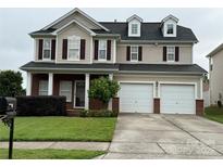 Charming two-story home with a well-manicured lawn and a two-car garage at 124 Glade Valley Ave, Mooresville, NC 28117