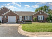 Charming brick home with a manicured lawn, attached garage, and inviting front entrance at 1610 Union Rd # 1610B, Gastonia, NC 28054