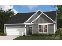 Charming single-Gathering home featuring gray siding, a two-car garage, and well-maintained landscaping at 5232 Raging Creek Dr, Indian Trail, NC 28079