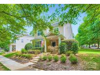 Charming two-story home with landscaped yard, stone accents and an inviting front porch at 10132 Caldwell Depot Rd, Cornelius, NC 28031