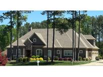 Charming single-story home with stone accents and well-manicured landscaping at 141 Castle Dr, Mooresville, NC 28117