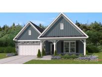 Charming home featuring gray siding, a stone-accented garage, and a cozy front porch at 3061 Bent Willow Dr, Indian Trail, NC 28079
