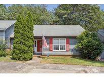 Charming single-story home with red shutters, inviting front yard and mature trees at 432 English Ivy Ct, Fort Mill, SC 29715