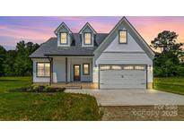 Charming two-story home featuring a two-car garage and well-maintained front lawn at 1010 Oneil Dr, Monroe, NC 28112