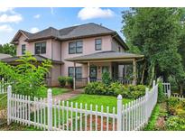 Charming two-story home featuring a white picket fence and a covered front porch at 1609 Begonia Way, Rock Hill, SC 29732