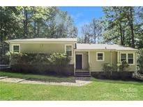 Charming single-story home with a well-maintained lawn and mature landscaping, offering great curb appeal at 4937 Post Oak Ln, Rock Hill, SC 29732