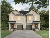 Charming two-story home features a welcoming front porch, attached garages, and well-manicured landscaping at 9705 Misenheimer Rd # 3A, Charlotte, NC 28215