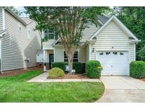 Charming home featuring a well-manicured lawn and a tree-lined yard with a one-car garage at 4703 David Cox Rd, Charlotte, NC 28269