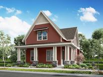 Charming home featuring a cozy front porch with stylish column supports and professionally landscaped front yard at 645 Hops Aly, Fort Mill, SC 29715
