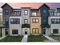 Modern townhome complex with a mix of brick and siding exteriors at 732 Falling Oak Aly # 22, Huntersville, NC 28078