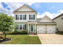 Charming two-story home with a well-manicured lawn and two car garage at 903 Von Buren Blvd, Rock Hill, SC 29730