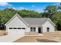 Charming single-story home with a two-car garage, gray roof, and manicured lawn at 4472 Pebblebrook Sw Cir, Concord, NC 28027