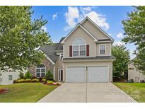 Charming two-story home with a two-car garage and well-maintained front lawn at 516 Cool Creek Dr, Rock Hill, SC 29732