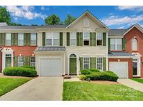 Charming townhome with green shutters, well-maintained lawn, and attached one-car garage at 6000 Boathouse Ln # C, Cramerton, NC 28032
