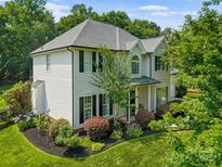 Charming two-story home featuring well-maintained landscaping and a classic design at 129 Nims Spring Dr, Fort Mill, SC 29715