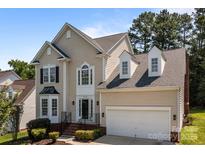 Charming two-story home with neutral siding, black shutters, and a well-maintained front yard at 4519 Rock Stream Dr, Charlotte, NC 28269