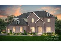 Stunning two-story brick home with dormer windows and manicured lawn, perfect for Gathering living at 9104 Ansley Park Pl # 264, Huntersville, NC 28078