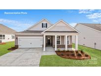 Charming single-Gathering home featuring a covered porch, attached garage, and well-manicured lawn at 502 York Rd, Troutman, NC 28166