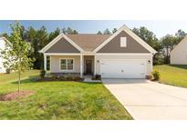 Charming single-Gathering home with neutral siding, well-manicured lawn, and a two-car garage at 5208 Admirals Lndg, Lancaster, SC 29720