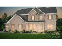 Charming two-story brick home with gray shutters, well-manicured landscaping, and inviting front porch at 8619 Balcony Bridge Rd # 413, Huntersville, NC 28078