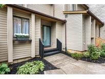 Charming entrance with wooden walkway, black railings, and a window box full of white flowers at 5192 Corbin Ln, Hickory, NC 28601