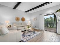 Bright living room features modern décor, a decorative fireplace, and sliding glass doors to a balcony at 5192 Corbin Ln, Hickory, NC 28601