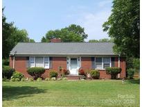 Charming brick ranch home with lush front yard and well-maintained landscaping at 1617 Madison St, Rock Hill, SC 29732