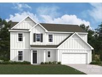 Charming two-story home featuring white siding, black door, and a two-car garage at 294 Winford Rd, Troutman, NC 28116