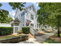 Charming multi-story home features a well-maintained front yard and inviting entrance with classic architectural detail at 432 W Worthington Ave, Charlotte, NC 28203