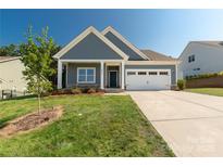 Charming home features a welcoming front porch and a well-manicured lawn, perfect for curb appeal at 5244 Admirals Lndg, Lancaster, SC 29720