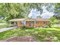 Charming brick home with covered driveway and beautiful landscaping at 617 Oak Grove Rd, Kings Mountain, NC 28086