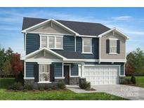 Charming two-story home featuring a mix of siding, stone accents, and a spacious two-car garage at 3228 Maya Ln # 40, Midland, NC 28107