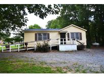 Cozy one-story home featuring a ramp and compact front yard space at 416 E Union St, Marshville, NC 28103