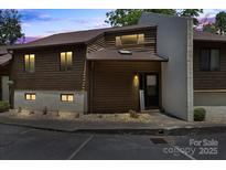 Charming townhouse featuring wood siding and a welcoming entrance with covered porch at 1420 11Th Street Nw Dr # 15, Hickory, NC 28601