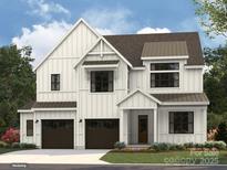 New construction white two-story home boasting a two car garage, and lovely landscaping at 2008 Thatcher Way, Fort Mill, SC 29715