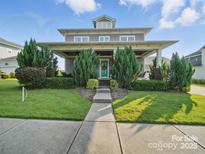 Charming two-story home with well-manicured landscaping and inviting front porch at 3007 Arsdale Rd, Waxhaw, NC 28173