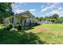 Charming one-story home with a covered front porch and well-maintained lawn at 3425 Long Ferry Rd, Salisbury, NC 28146