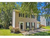 Charming home featuring a well-maintained lawn and a cozy, traditional design at 7217 Rena Mae Ln, Charlotte, NC 28227
