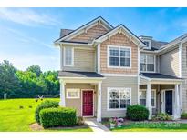 Charming townhome showcasing manicured landscaping and a striking red front door at 325 Hancock Union Ln, Rock Hill, SC 29732
