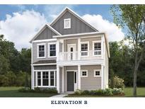 Charming two-story home featuring a covered porch, complemented by large windows and a gray color scheme at 4041 Grommet Ct, Matthews, NC 28105