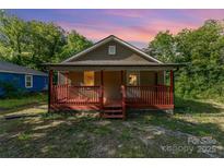 Charming single-story home with a cozy front porch and inviting curb appeal at 408 Orange St, Shelby, NC 28150