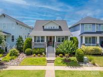 Charming home with a inviting front porch, beautiful lawn, and landscaped garden at 956 Herrons Ferry Rd, Rock Hill, SC 29730