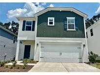 Charming two-story home with a two-car garage and a combination of white and green siding at 1358 31St Ne St, Conover, NC 28613