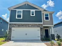 Charming two-story home featuring a two-car garage, stone accents, and a welcoming front porch at 1431 31St Ne St, Conover, NC 28613