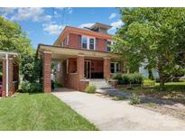 Charming two-story brick home with a covered parking area and well-maintained front yard at 206 Mitchell Ave, Salisbury, NC 28144