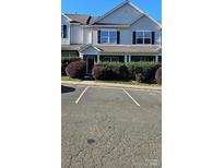 Charming townhouse with well-maintained landscaping and designated parking spaces at 3549 Calpella Ct, Charlotte, NC 28262