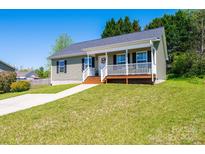 Charming single-story home with a covered front porch and well-manicured lawn at 50 Serenity Ln, Hickory, NC 28601