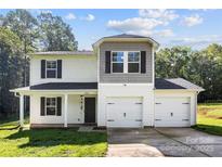 Charming two-story home with a two-car garage, manicured lawn, and inviting front porch at 109 Landon Ct, Shelby, NC 28152