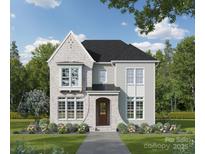 Charming two-story home with stone accents, a covered porch, and manicured landscaping at 19040 Newburg Hill Rd, Davidson, NC 28036